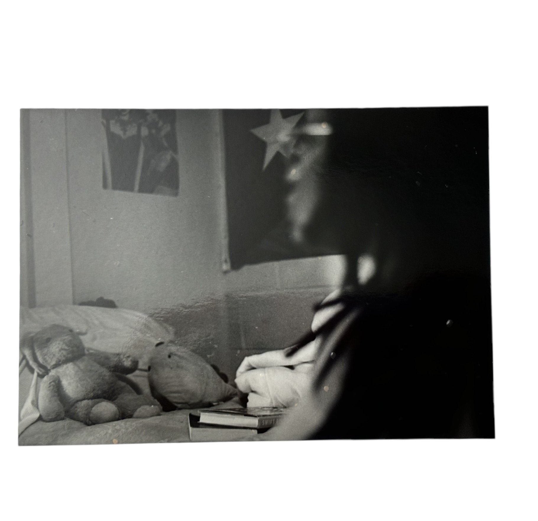 A quiet black-and-white photographic study of a bedroom