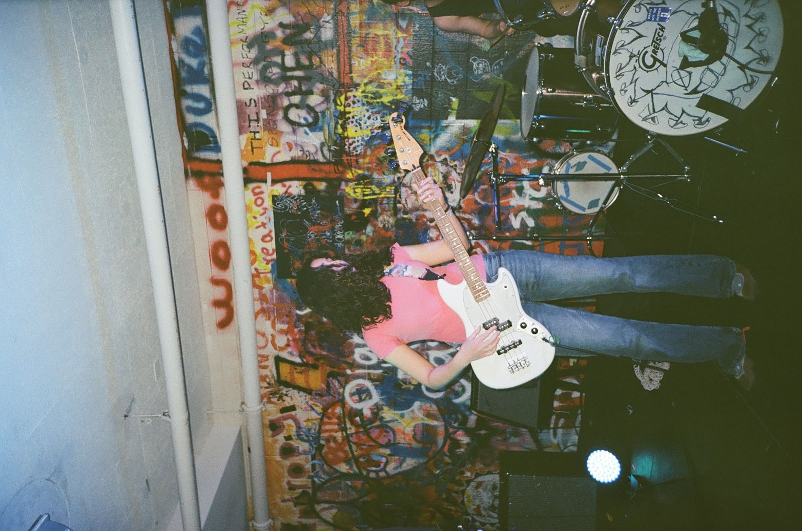 A musician playing guitar at a live set